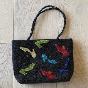 Chic Black Beaded Bag with Vibrant Shoe Accents